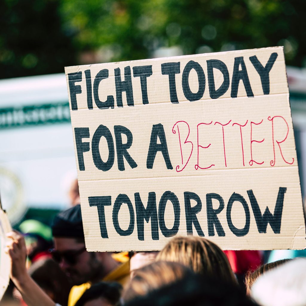 Person holding a sign at a protest