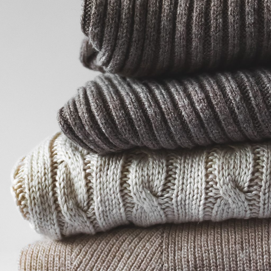 Pile of folded sweaters