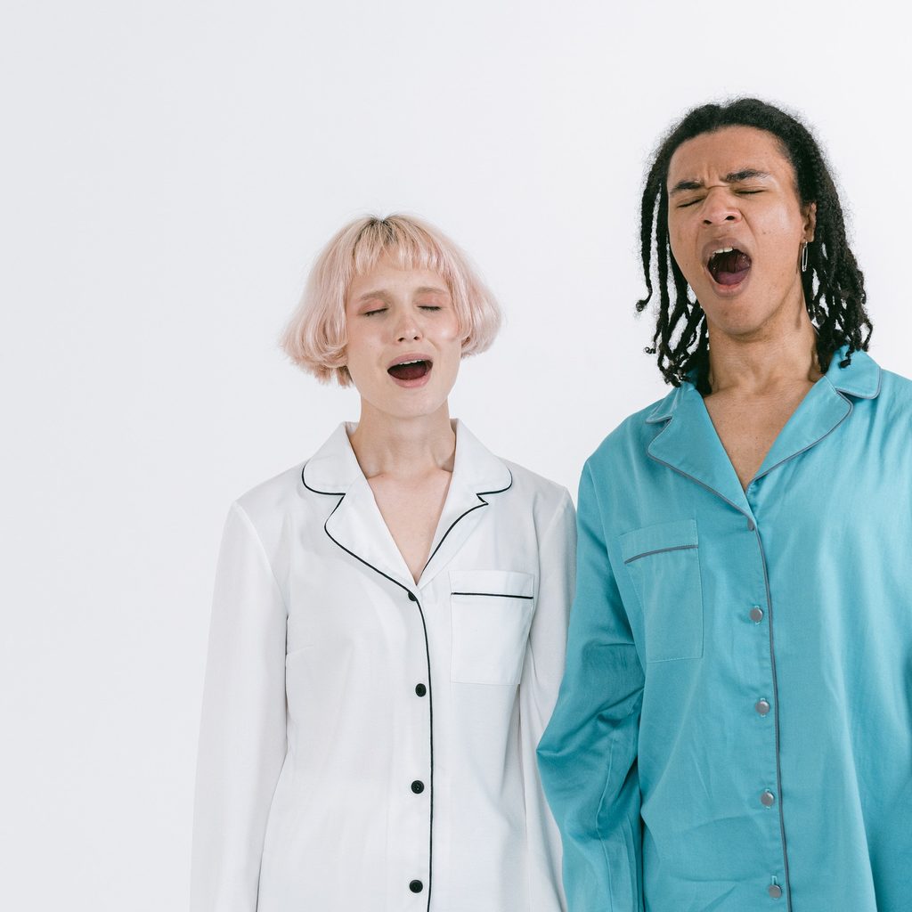 Woman and Man Yawning