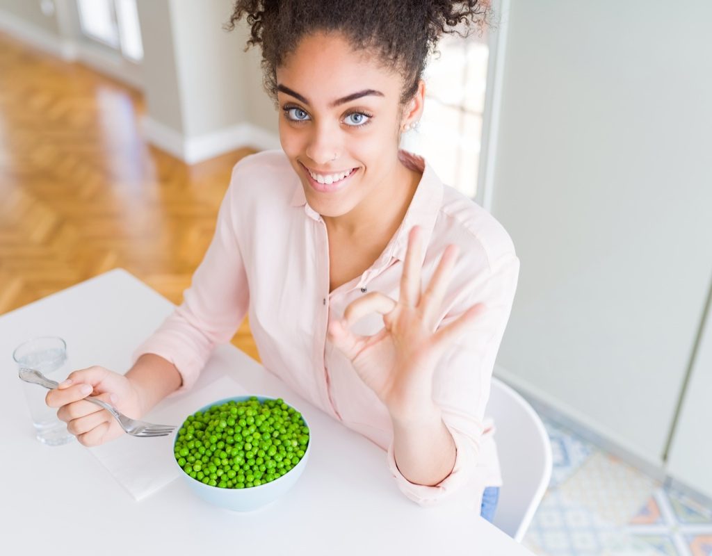 woman eating green