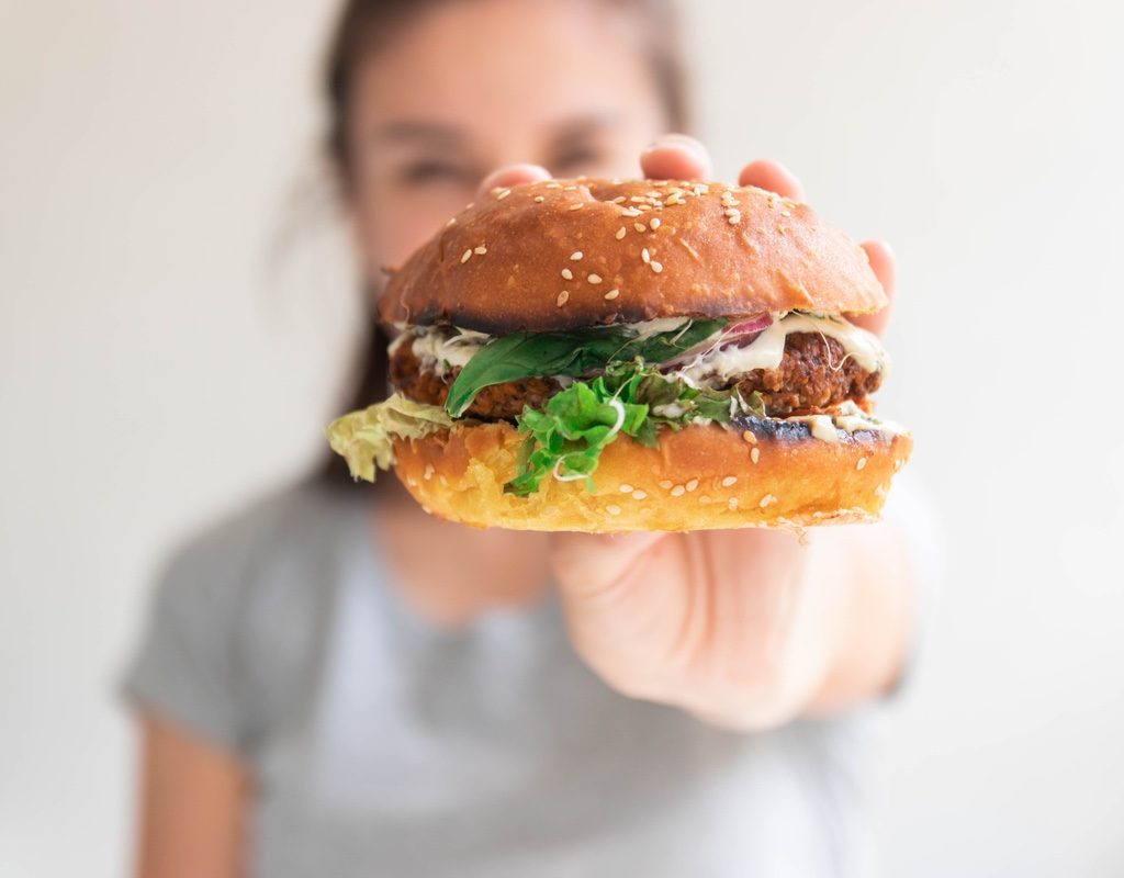 woman eating a veggie burger