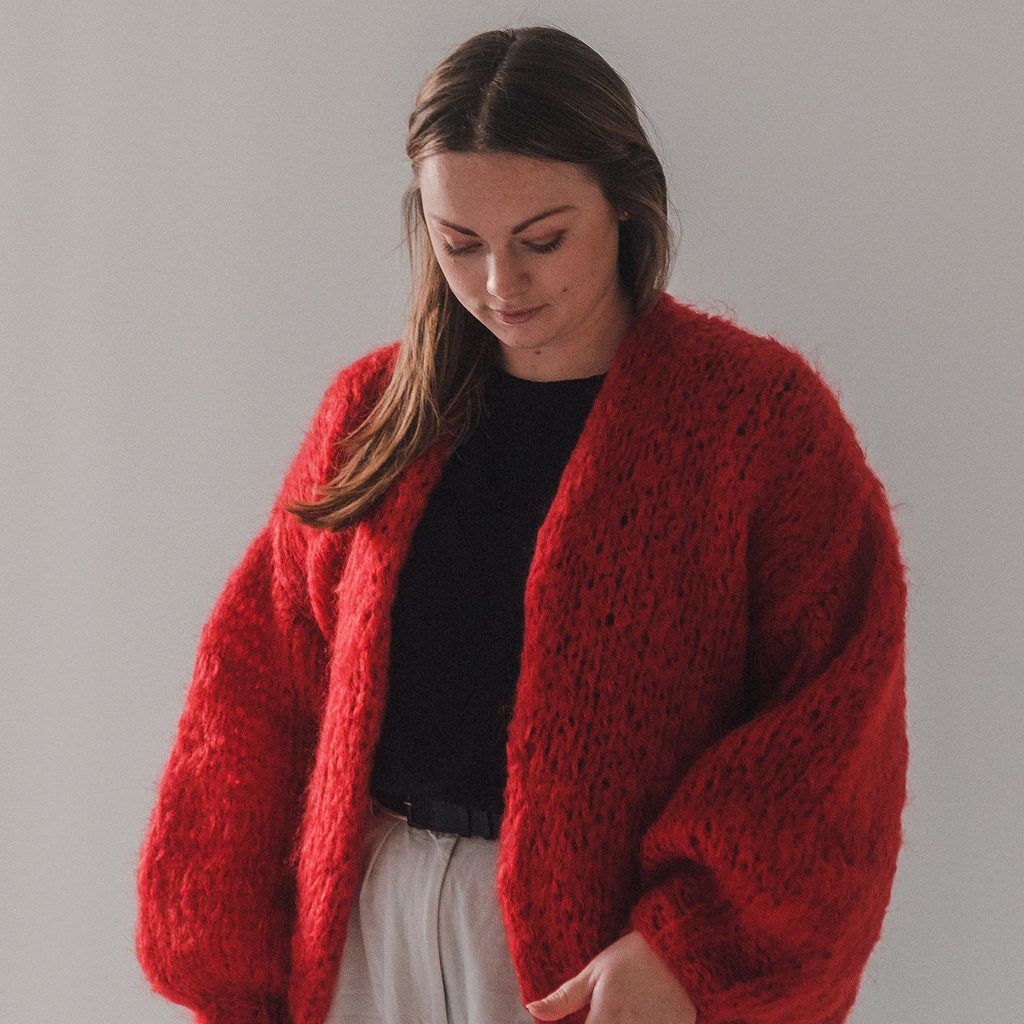 Woman wearing a red cardigan