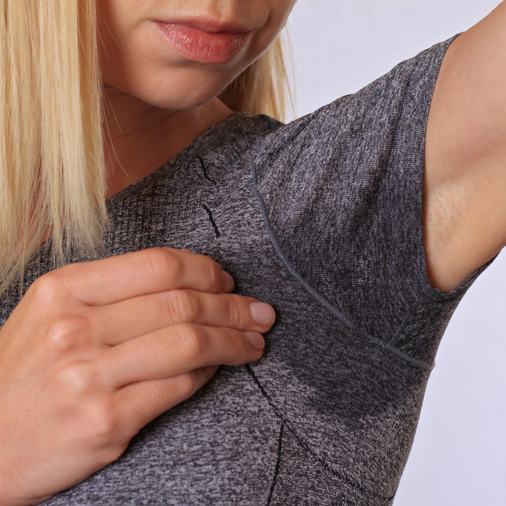 Woman in t-shirt with sweat stains