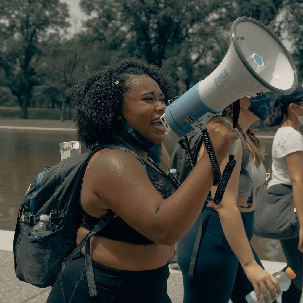 Woman with a megaphone at a protest