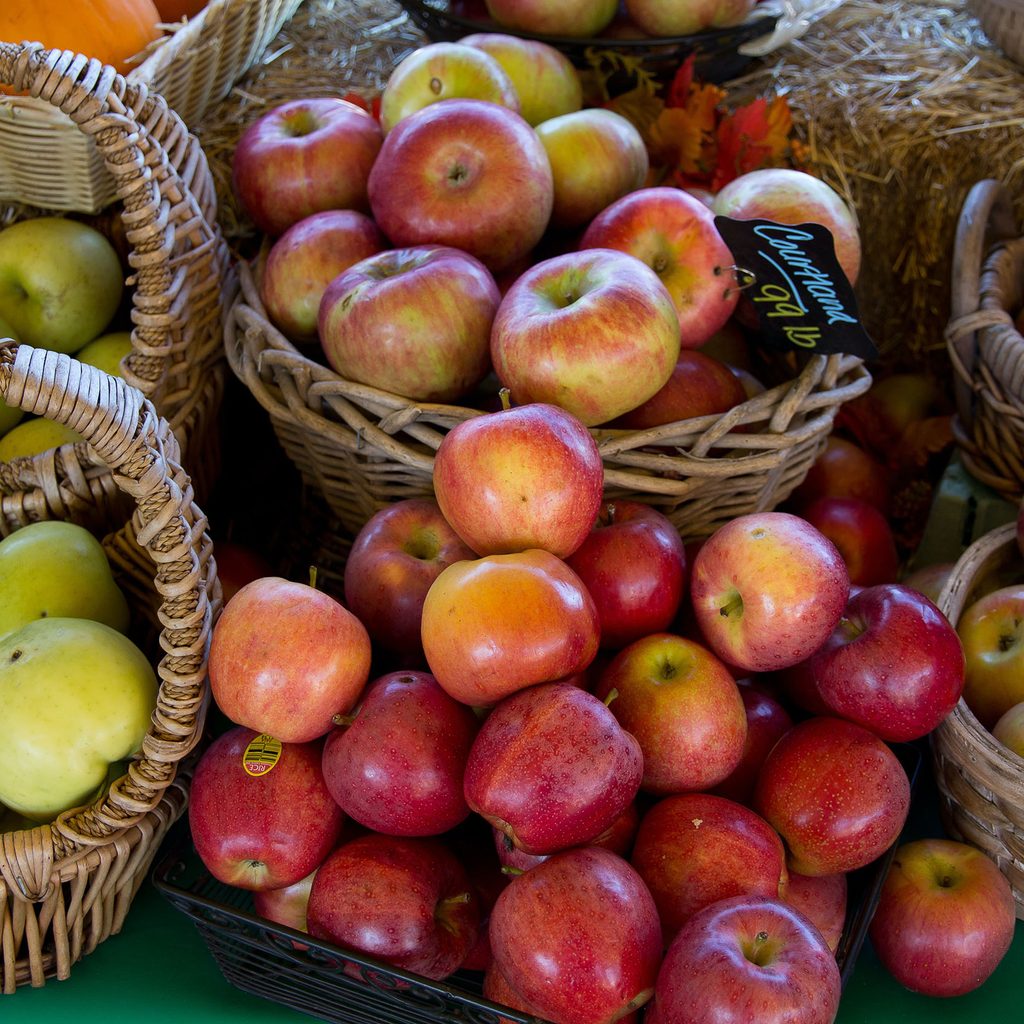 Apples in baskets for sale