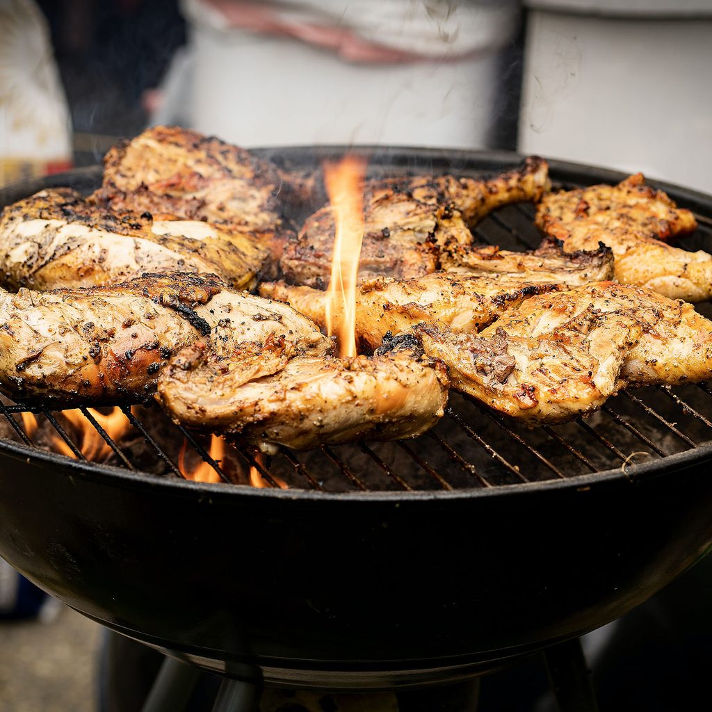 Chicken cooking on a grill