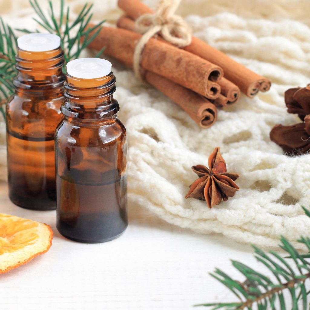 Essential oils with cinnamon, cloves, and herbs