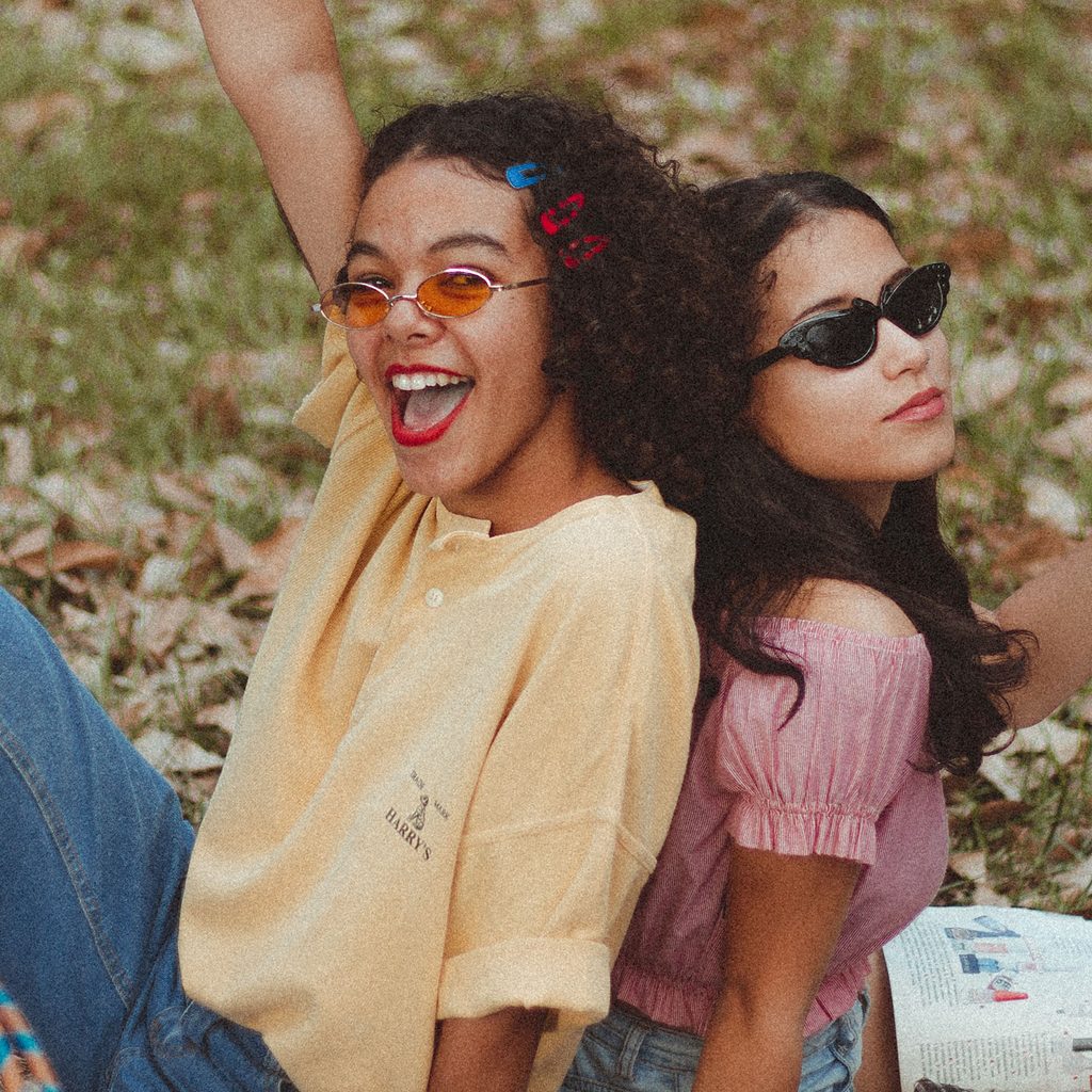 Friends sitting outside in the fall