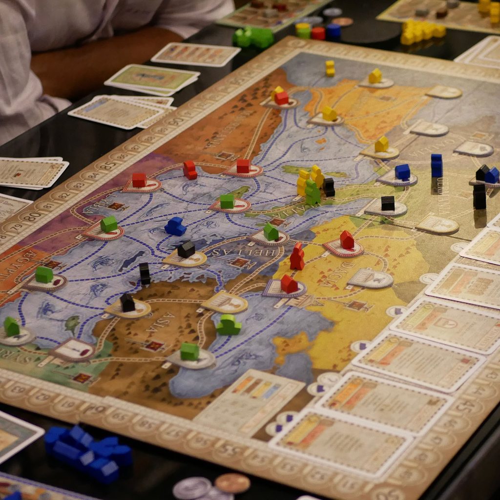 People playing the board game Concordia