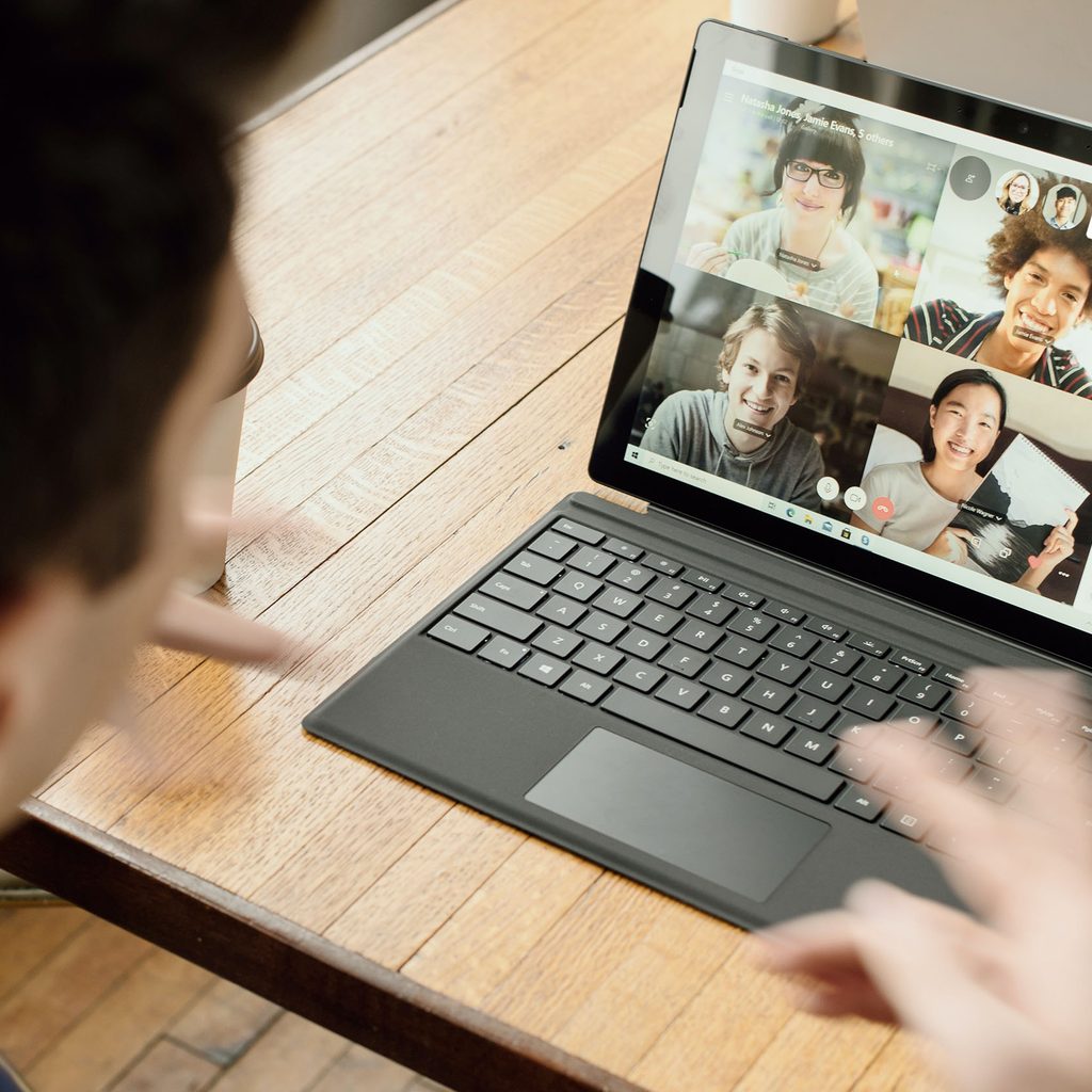 Person on a video call with four others