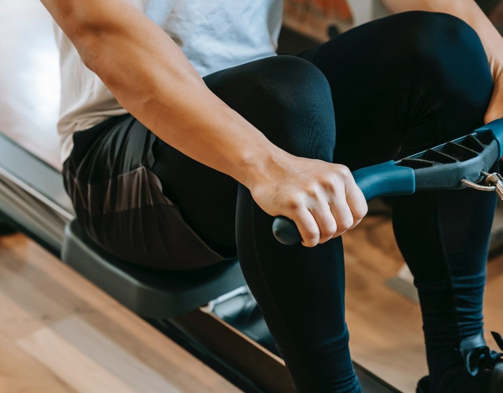 person on a rowing machine