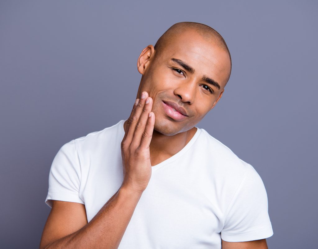 A man with a shaved head.