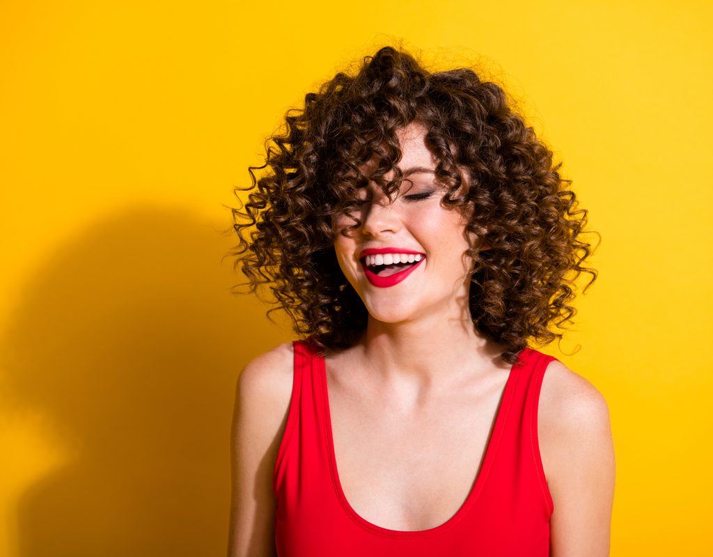 A woman with curly hair.