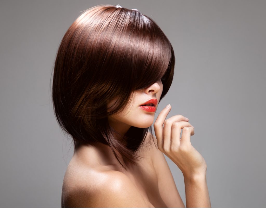 A woman with a short haircut and shiny, beautiful hair.