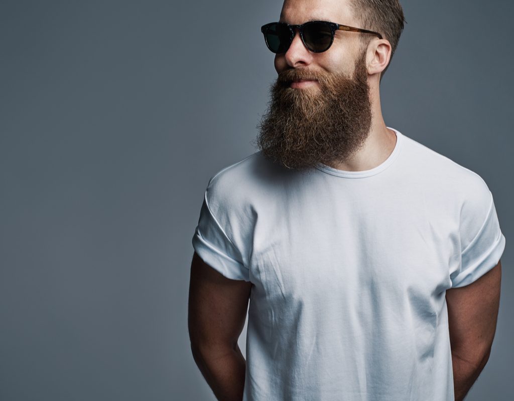 A bearded man wearing sunglasses.