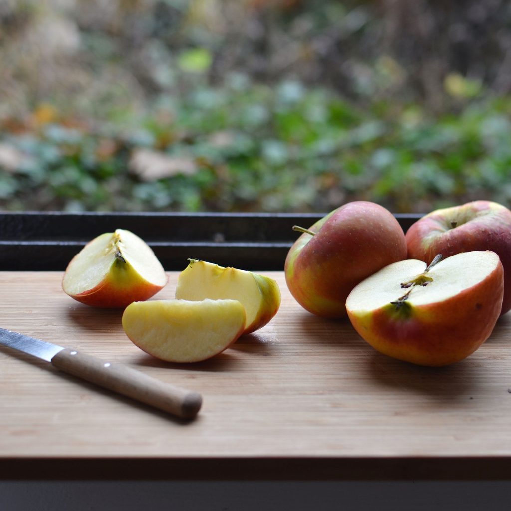 Sliced apples on a cutting board