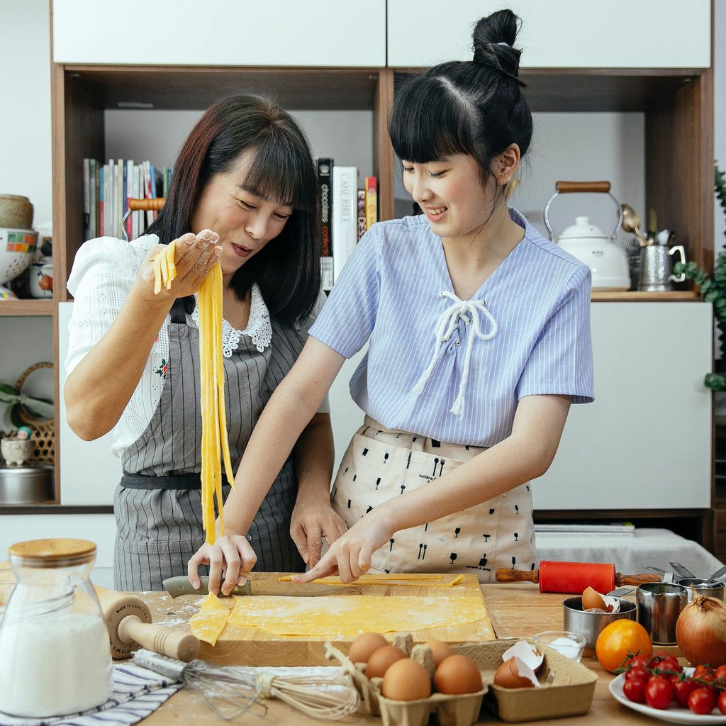 Two women making pasta