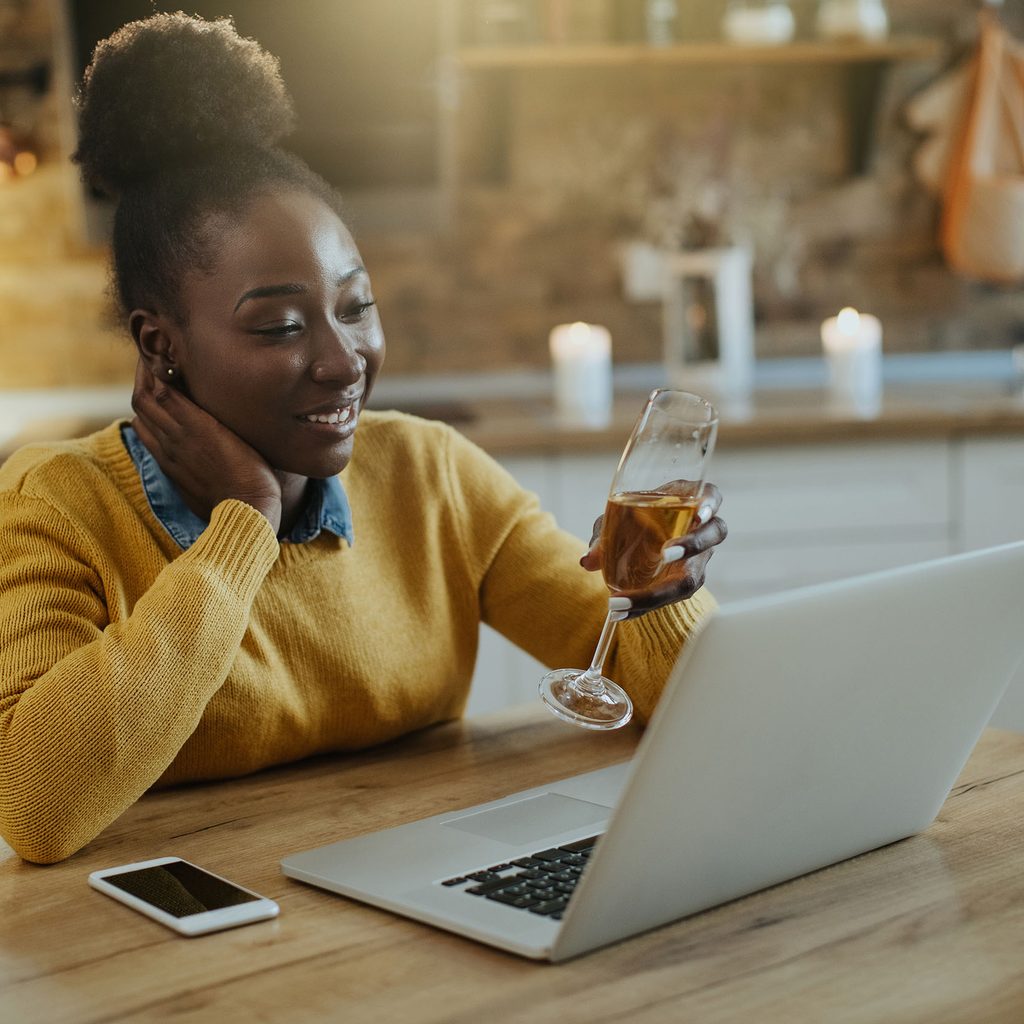 Woman enjoying a virtual happy hour