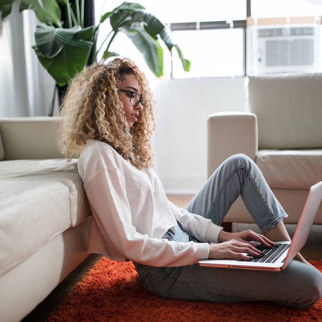 Woman researching on a laptop