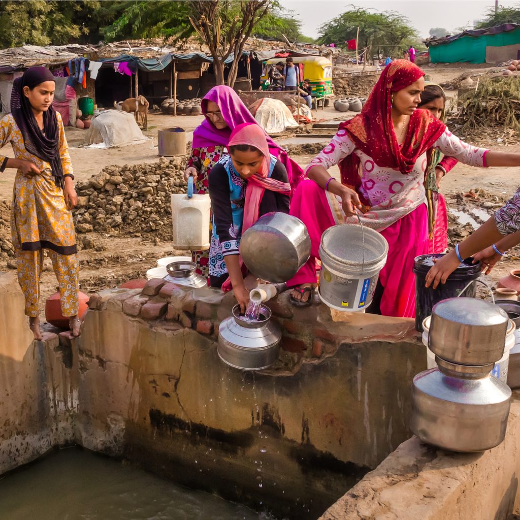 Women in India gathering water from well