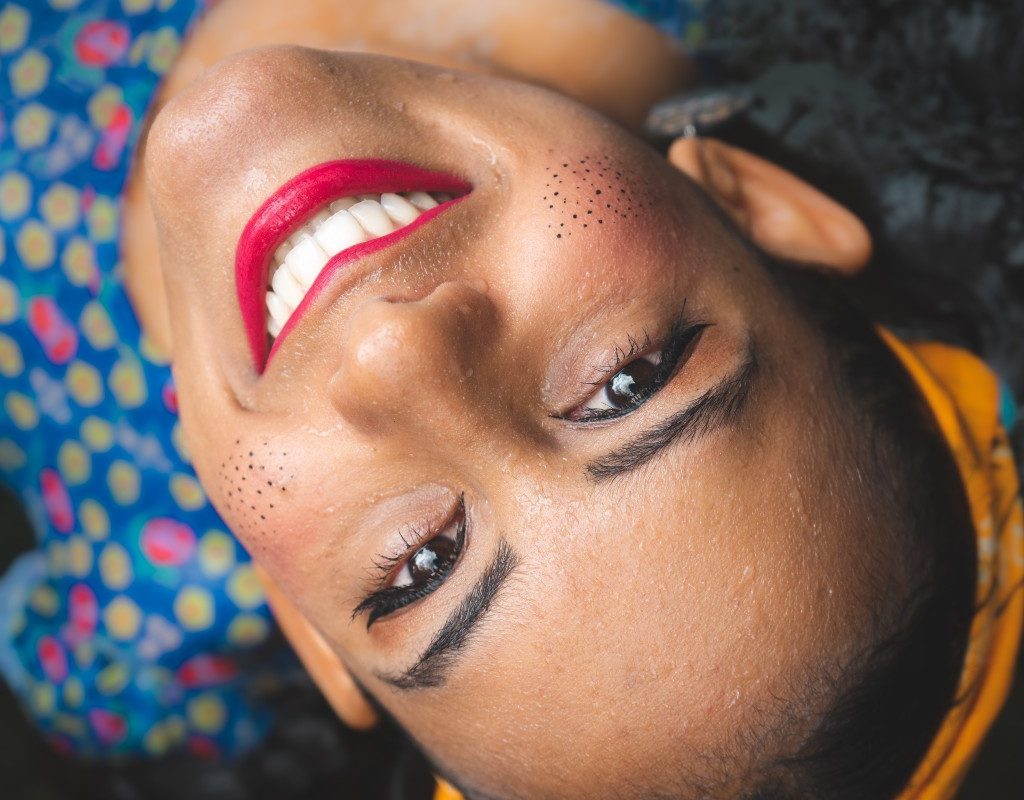 woman with red lipstick smiling