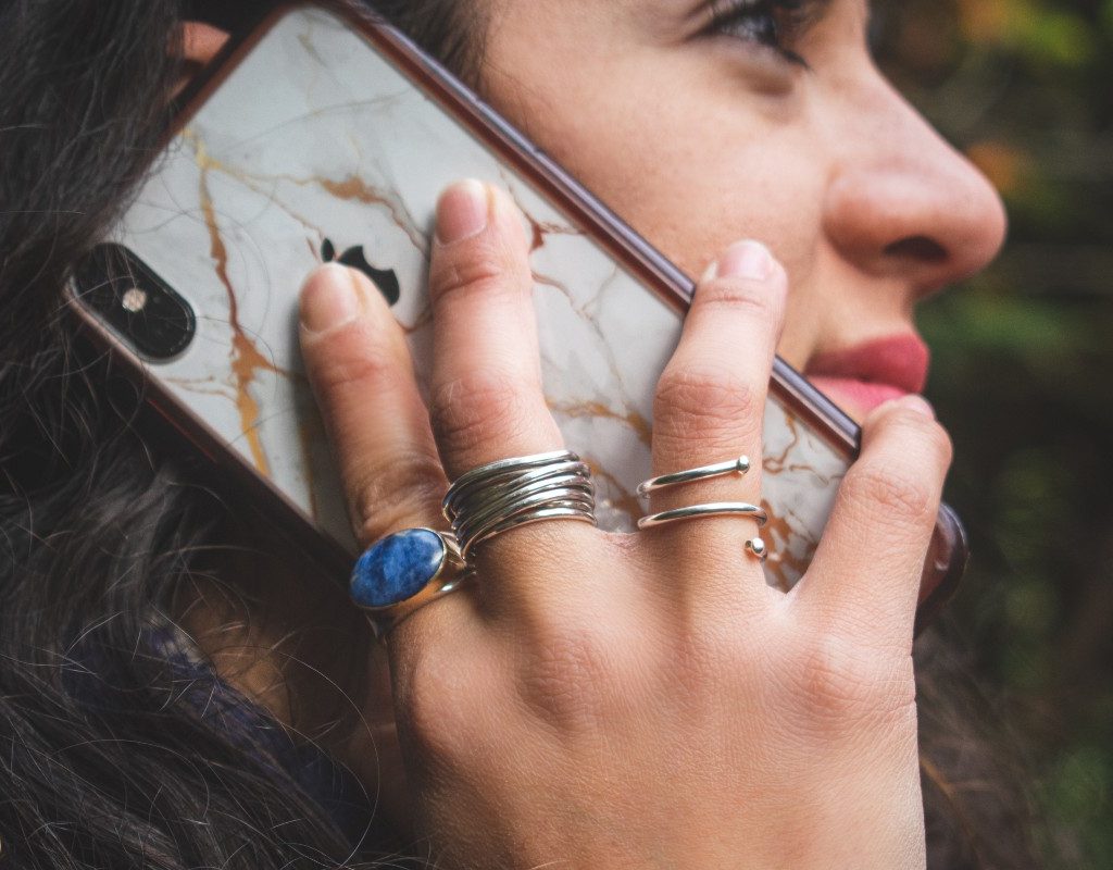 a closeup of a happy woman on the phone