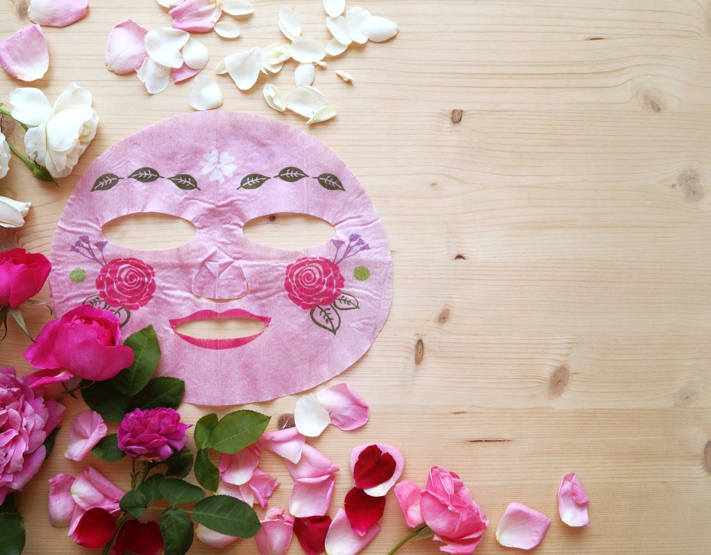 Face mask with flowers around it.