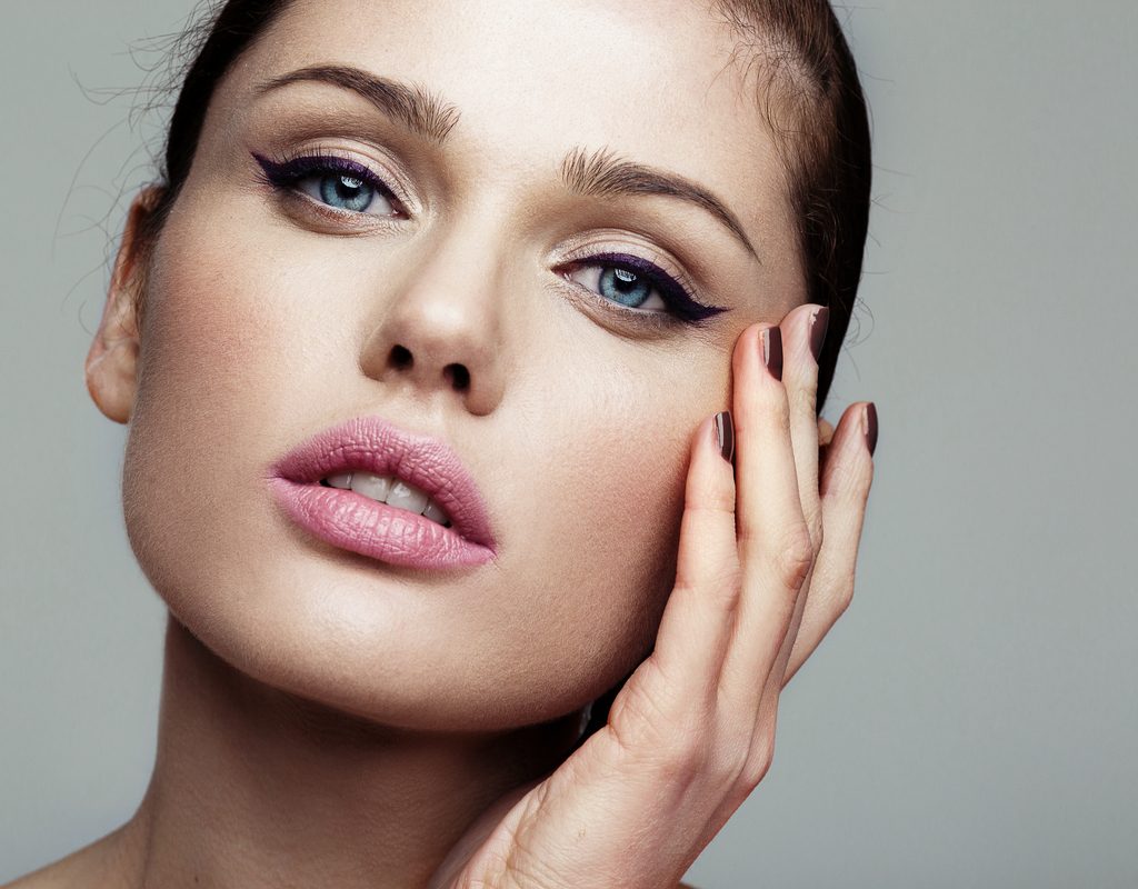 A woman with cat eye makeup.