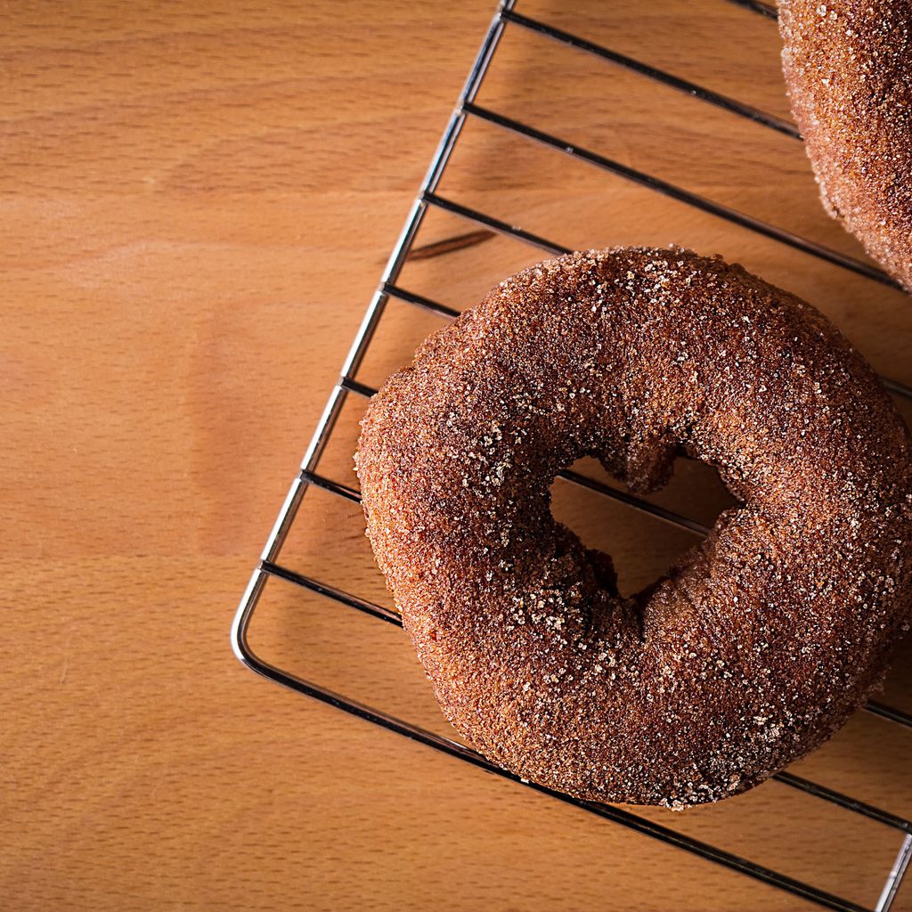 Three doughnuts on a cooling rack