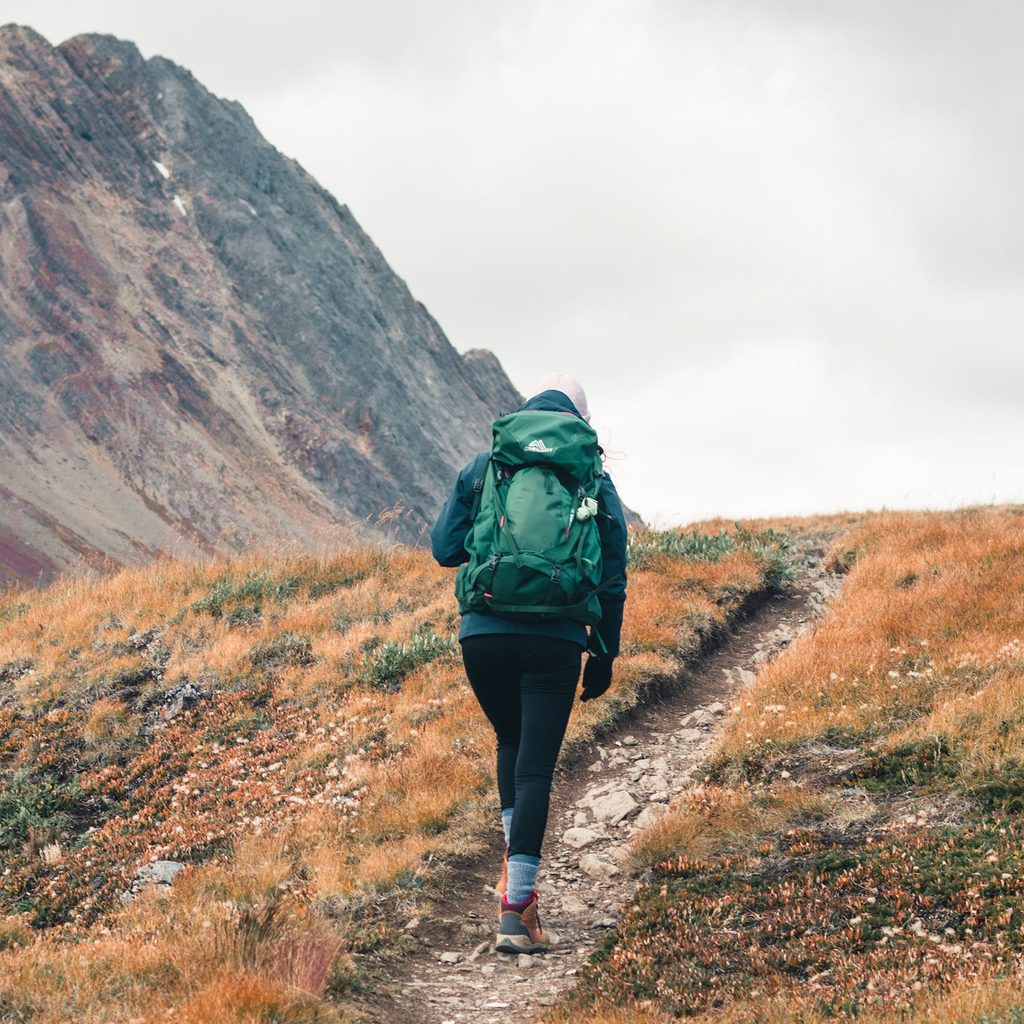 Woman hiking uphill