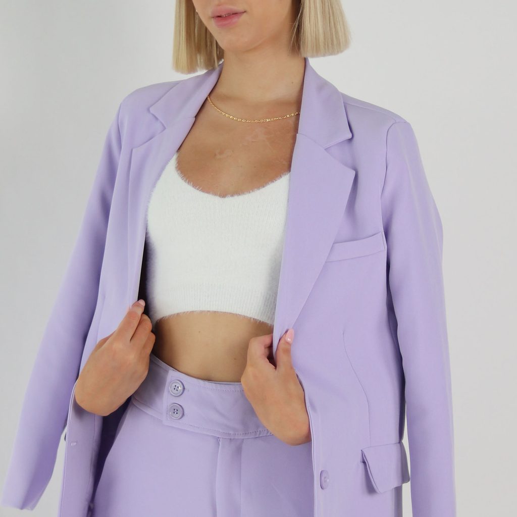 Woman in a monochrome lavender suit