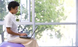 balance ball vs office chair woman laptop