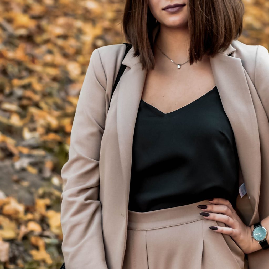 Woman wearing neutral blazer suit