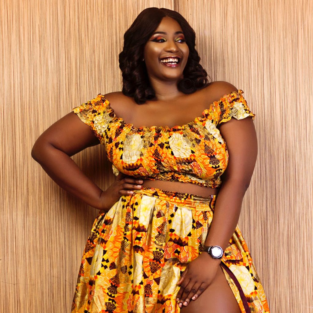 PLus-size woman wearing a bold patterned dress set
