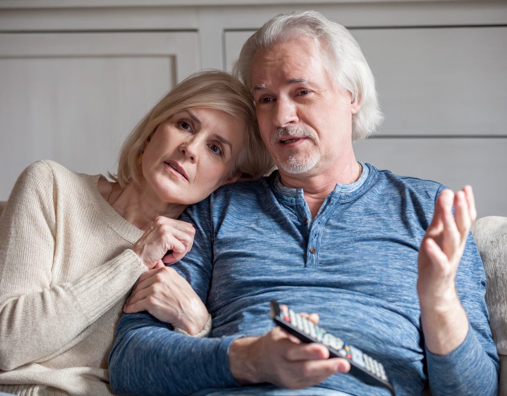 A couple watching a show and having a discussion.