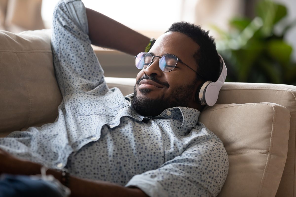 A man listening to a fun podcast.