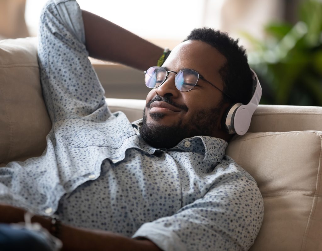 A man listening to a fun podcast.