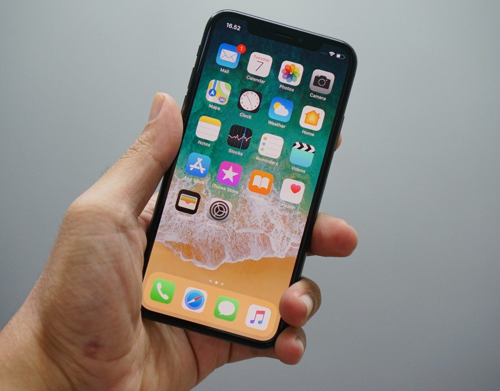 a person holding up an iPhone