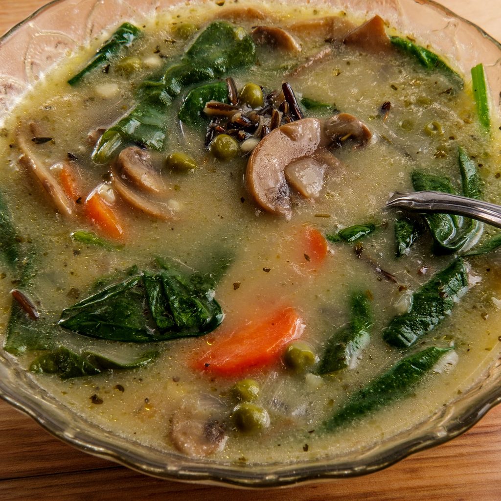 Bowl of wild rice soup with mushrooms and spinach