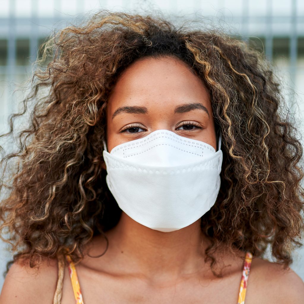 A woman wearing a face mask.