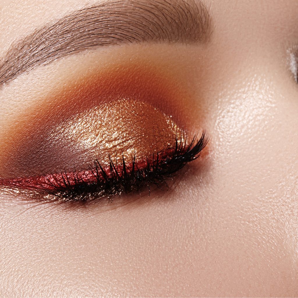 Closeup of woman's eyes with metallic eyeshadow
