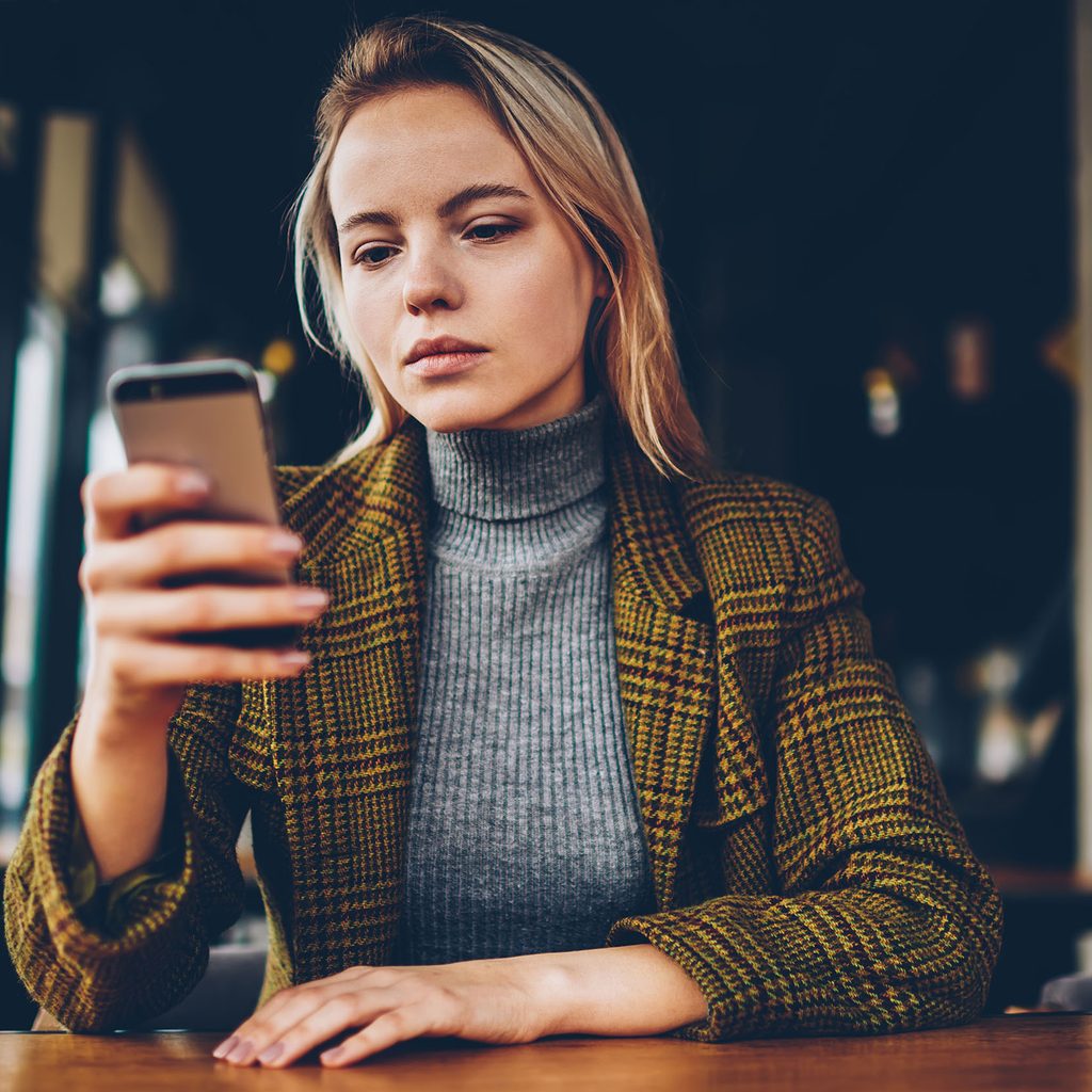 Woman looking at smartphone