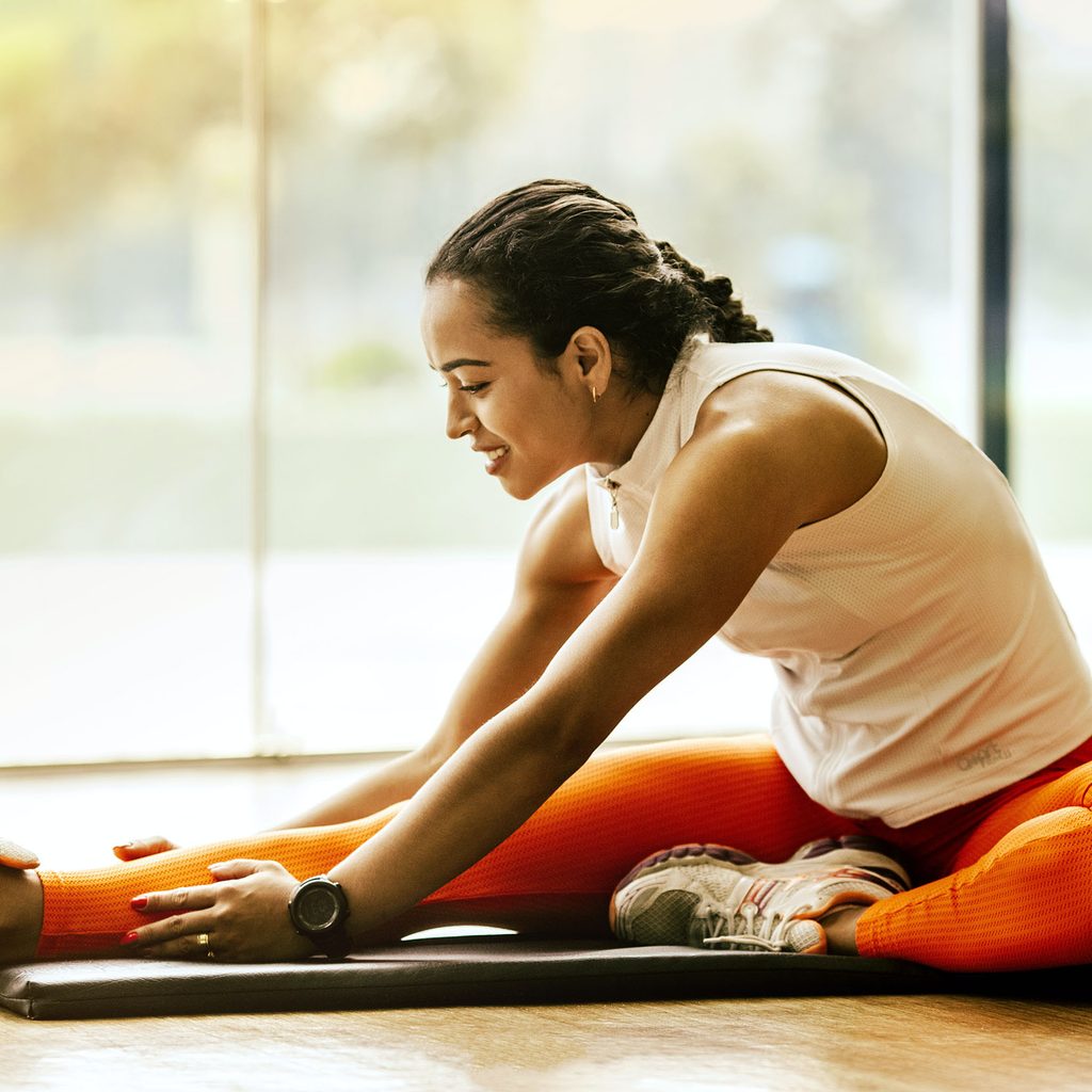 Woman stretching and exercising