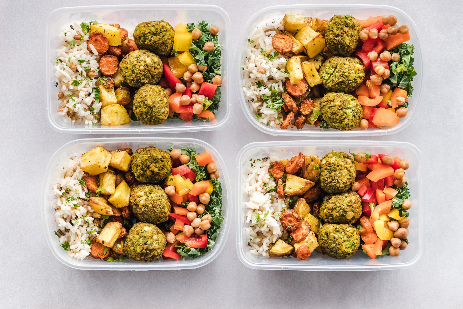 Four containers of healthy food.