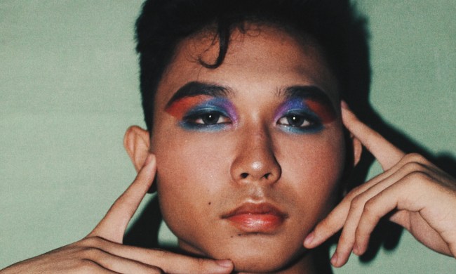 Man wearing bold make-up