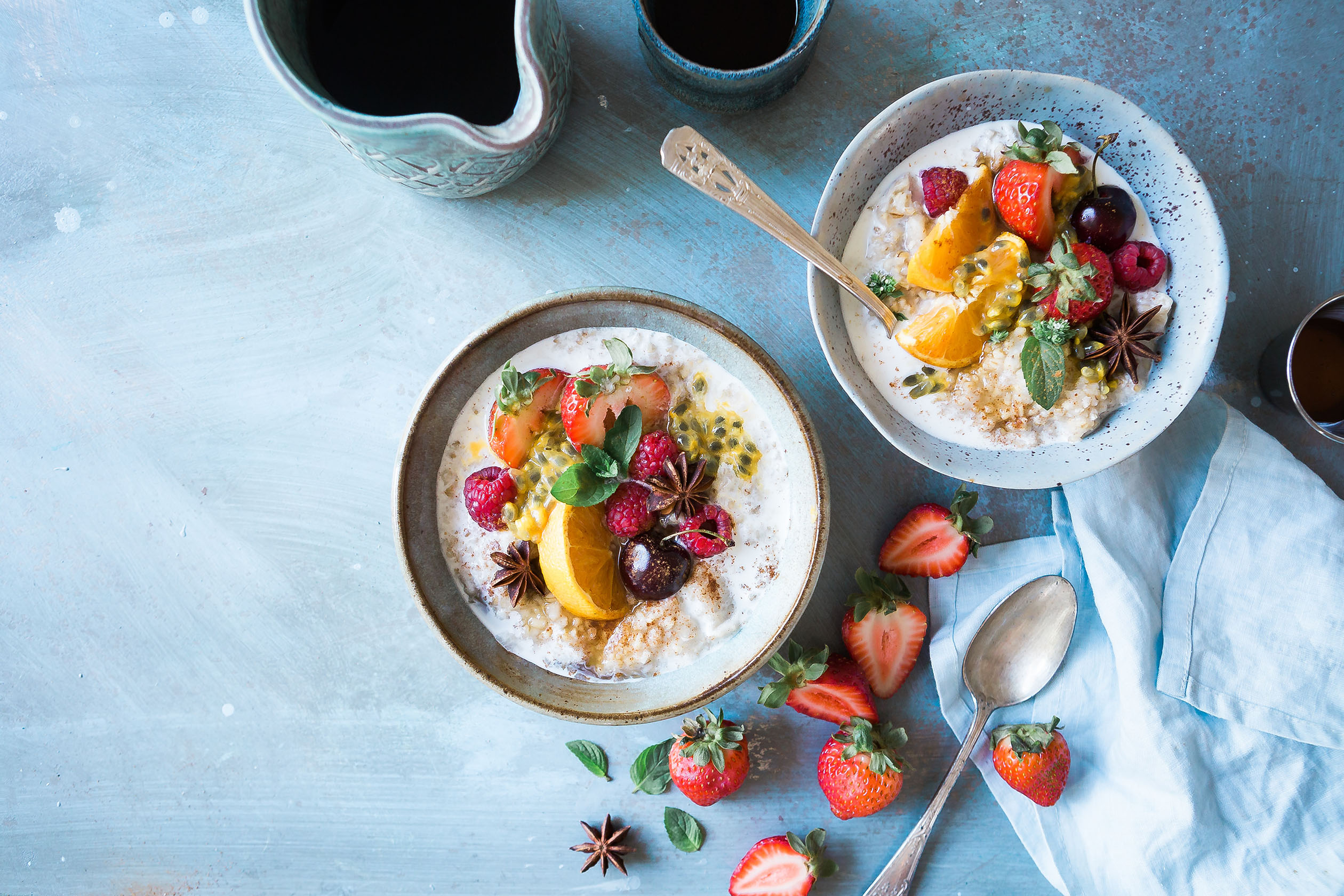bowls of oatmeal and fruit