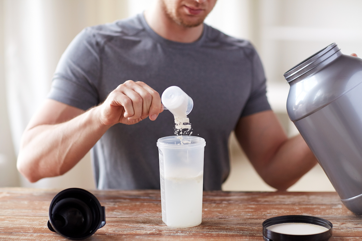 man mixing protein shake
