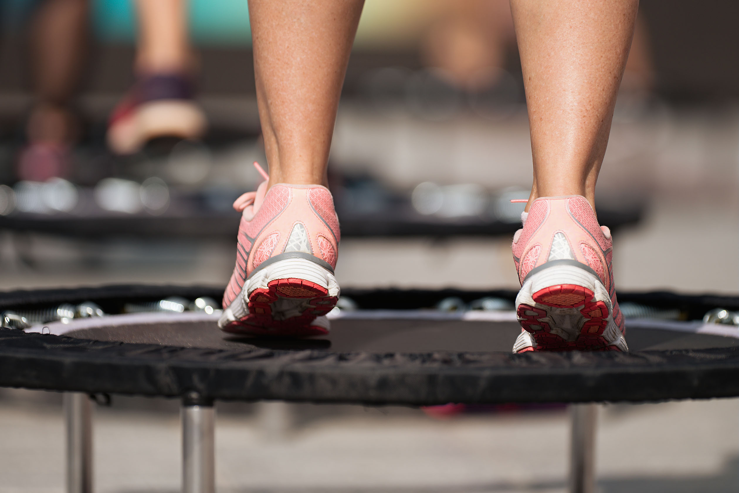 woman exercising on a mini trampoline