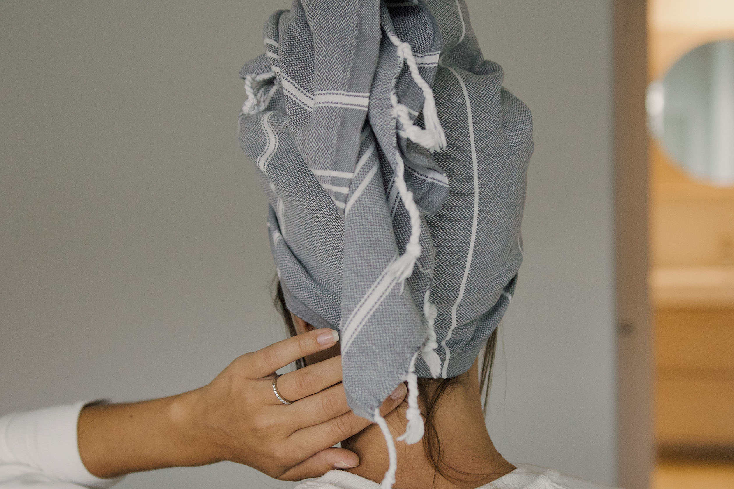 Woman with hair wrapped in towel