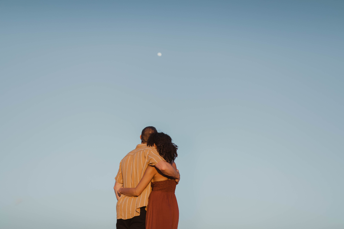 Couple looks at the moon